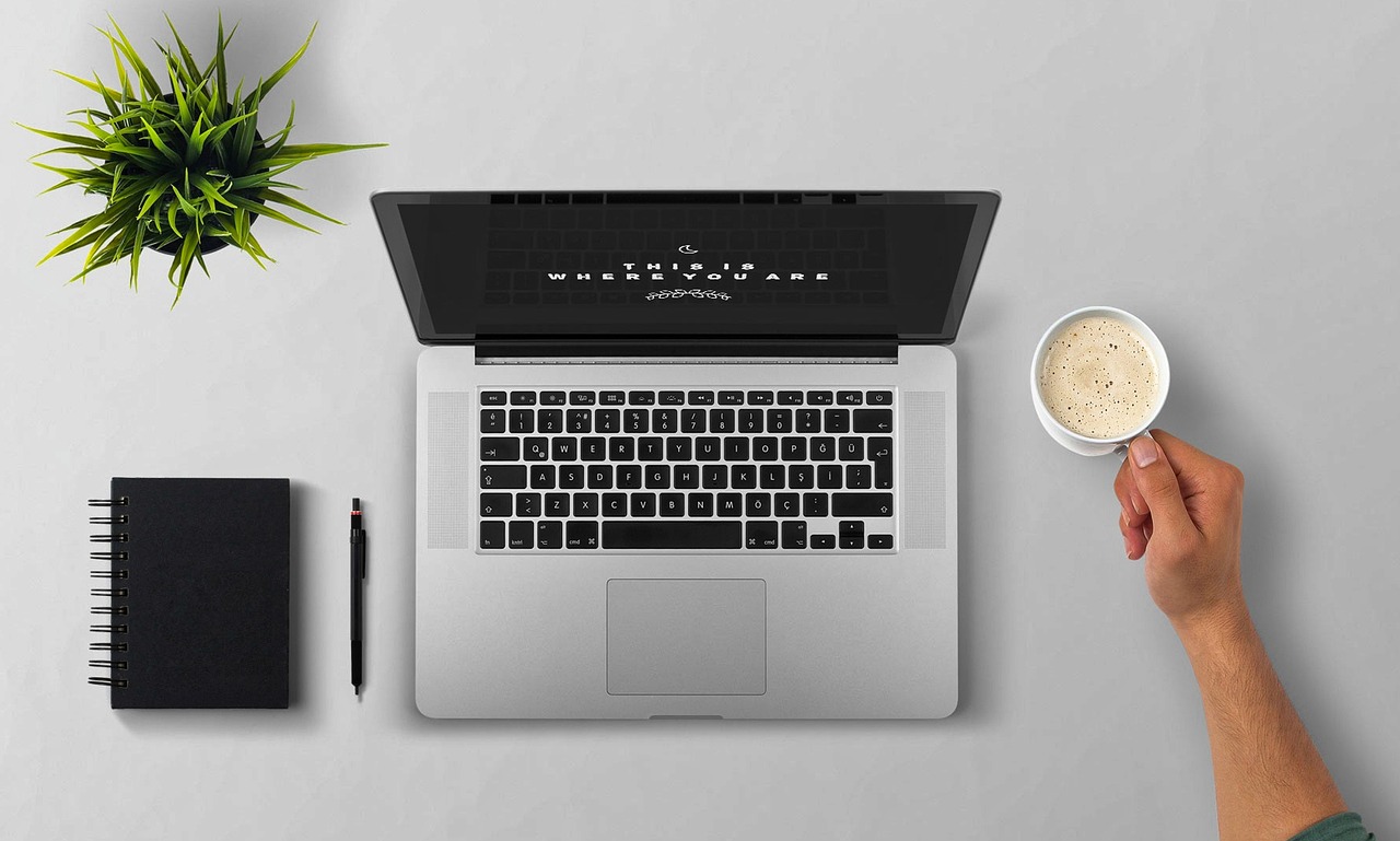 Laptop, coffee, arm — Great Tips To Increase The Safety Of Your House With A Roof Contractor in Ephrata
